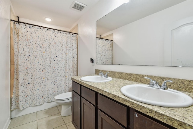 full bathroom with tile patterned floors, visible vents, a sink, and toilet