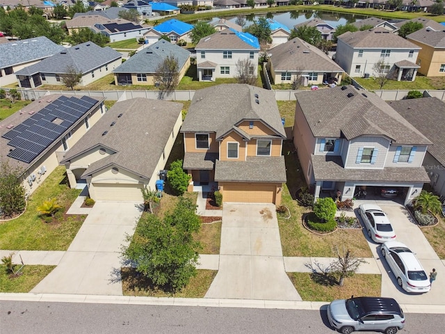 birds eye view of property with a residential view