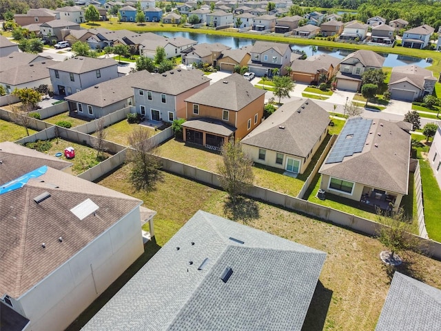 bird's eye view featuring a water view and a residential view
