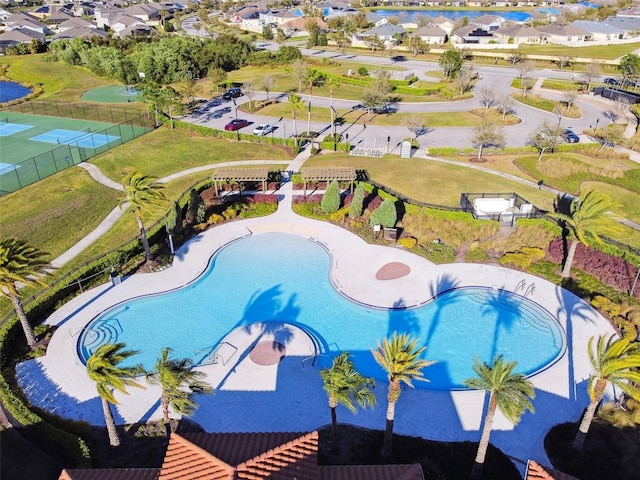 view of pool with fence and a residential view
