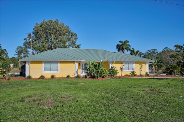 6589 Banyan Dr, Indian Lake Estates, FL 33855 - ranch-style home featuring a front yard and stucco siding