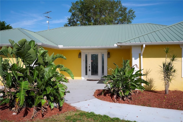 6589 Banyan Dr, Indian Lake Estates, FL 33855 - doorway to property with stucco siding