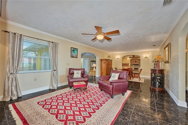 6589 Banyan Dr, Indian Lake Estates, FL 33855 - living room with baseboards, a ceiling fan, arched walkways, and granite finish floor