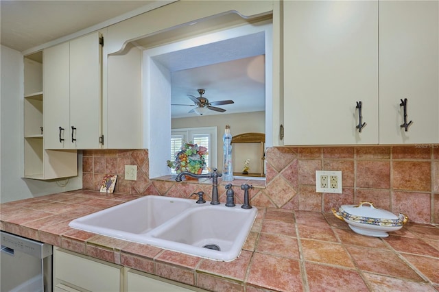 6589 Banyan Dr, Indian Lake Estates, FL 33855 - kitchen featuring stainless steel dishwasher, tasteful backsplash, open shelves, a ceiling fan, and a sink