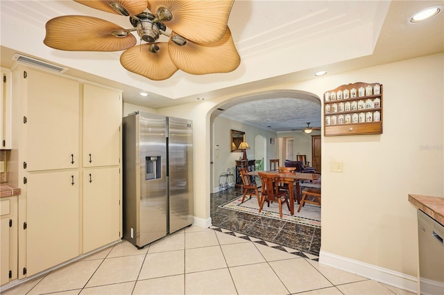 6589 Banyan Dr, Indian Lake Estates, FL 33855 - kitchen with a tray ceiling, arched walkways, appliances with stainless steel finishes, and ceiling fan
