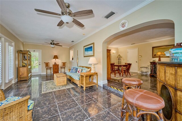 6589 Banyan Dr, Indian Lake Estates, FL 33855 - living room with baseboards, granite finish floor, visible vents, ceiling fan, and arched walkways