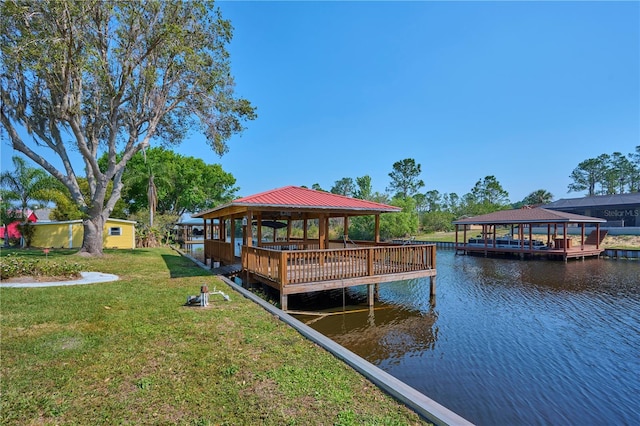 6589 Banyan Dr, Indian Lake Estates, FL 33855 - dock area with a gazebo, a water view, and a lawn