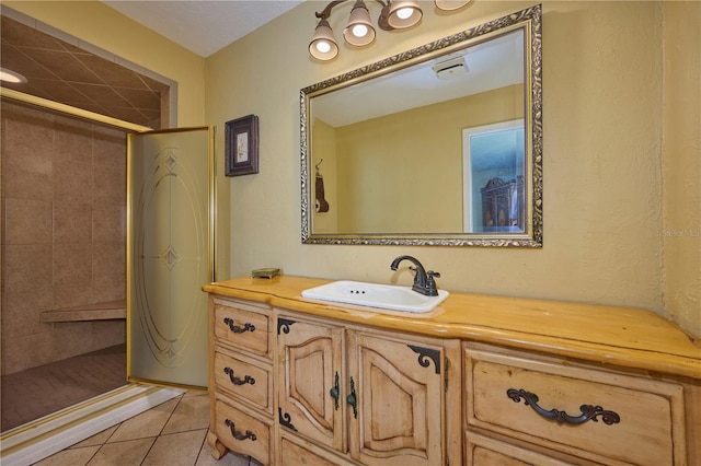 6589 Banyan Dr, Indian Lake Estates, FL 33855 - bathroom featuring tile patterned floors, vanity, and a stall shower