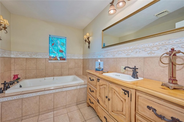 6589 Banyan Dr, Indian Lake Estates, FL 33855 - bathroom with a bath, vanity, tile patterned flooring, and a wainscoted wall