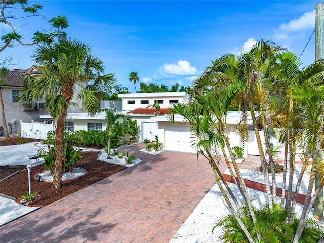 5430 Avenida Del Mare, Sarasota, FL 34242 - view of front of property featuring decorative driveway, stucco siding, and an attached garage