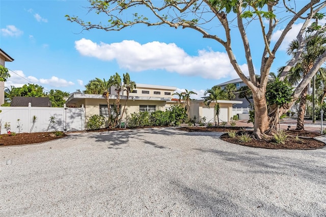 5430 Avenida Del Mare, Sarasota, FL 34242 - view of front of house featuring gravel driveway and stucco siding