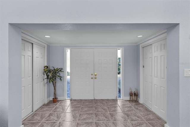 5430 Avenida Del Mare, Sarasota, FL 34242 - foyer entrance featuring crown molding and recessed lighting