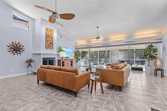 5430 Avenida Del Mare, Sarasota, FL 34242 - living area with a ceiling fan, a tile fireplace, track lighting, and high vaulted ceiling