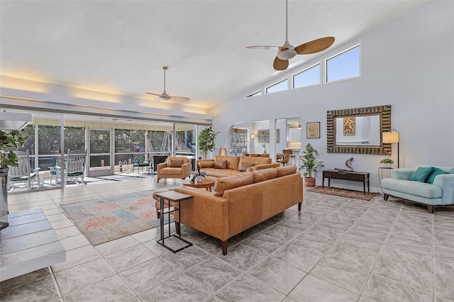 5430 Avenida Del Mare, Sarasota, FL 34242 - living room featuring a ceiling fan, arched walkways, and high vaulted ceiling