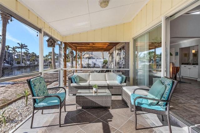 5430 Avenida Del Mare, Sarasota, FL 34242 - sunroom featuring a water view, an outdoor hangout area, and vaulted ceiling