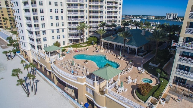 aerial view of a pool area and apartment complex