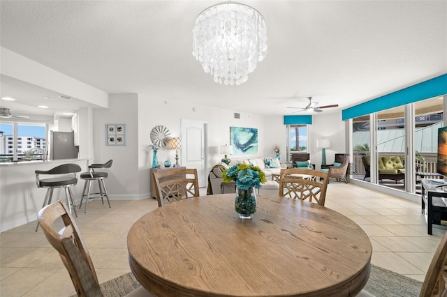 dining space featuring ceiling fan, light tile patterned floors, healthy amount of natural light, and recessed lighting