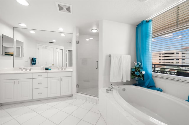 full bath with a garden tub, a shower stall, double vanity, tile patterned flooring, and recessed lighting