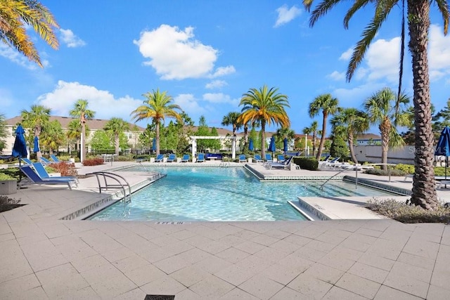 community pool featuring a patio area