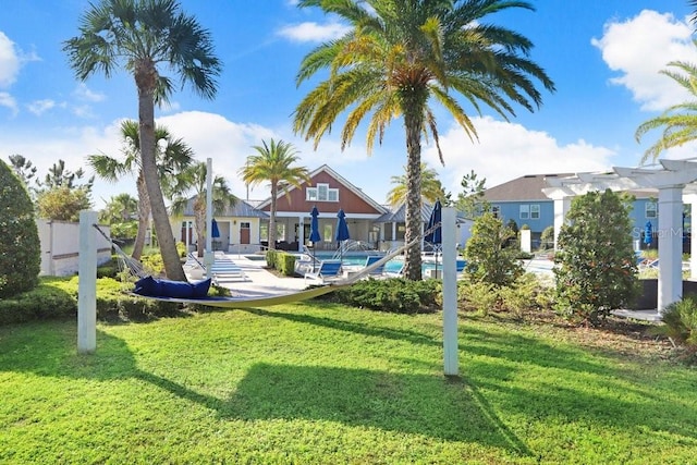 view of yard featuring a patio area and a community pool