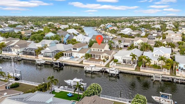 bird's eye view with a water view and a residential view