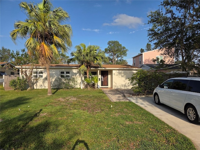3919 Harrisburg St NE, Saint Petersburg, FL 33703 - ranch-style house featuring stucco siding and a front lawn