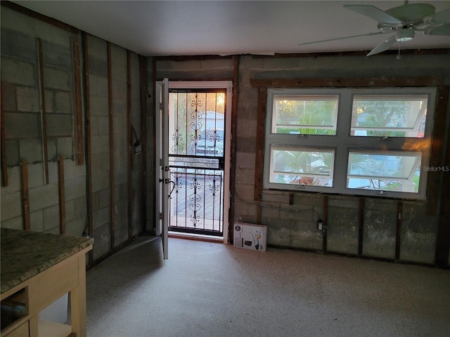 3919 Harrisburg St NE, Saint Petersburg, FL 33703 - interior space with a ceiling fan and concrete block wall