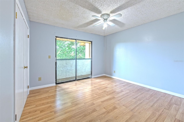 1424 Highland Ridge Cir, Brandon, FL 33510 - unfurnished room featuring a textured ceiling, baseboards, light wood finished floors, and a ceiling fan