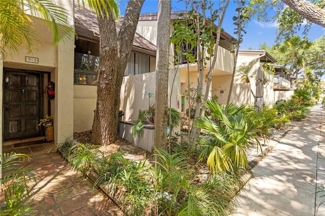 19440 NE 26th Ave Unit 53B, Miami, FL 33180 - property entrance featuring stucco siding and fence