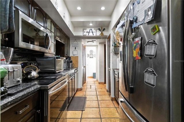 19440 NE 26th Ave Unit 53B, Miami, FL 33180 - kitchen with appliances with stainless steel finishes, recessed lighting, and baseboards