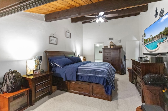 19440 NE 26th Ave Unit 53B, Miami, FL 33180 - bedroom with light carpet, beam ceiling, and ceiling fan