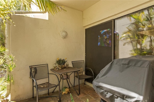 19440 NE 26th Ave Unit 53B, Miami, FL 33180 - property entrance featuring stucco siding and a patio