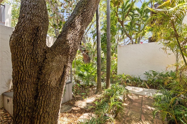 19440 NE 26th Ave Unit 53B, Miami, FL 33180 - view of side of property featuring stucco siding and a patio area