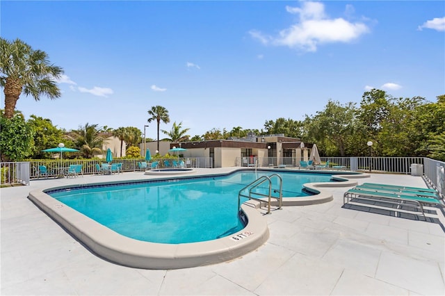 19440 NE 26th Ave Unit 53B, Miami, FL 33180 - community pool with fence and a patio area