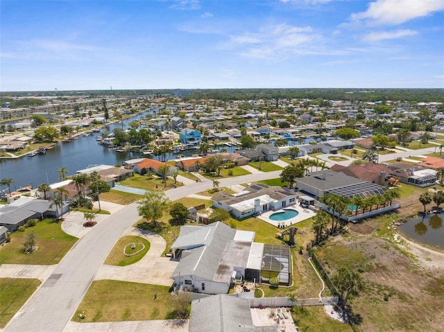 drone / aerial view featuring a water view and a residential view