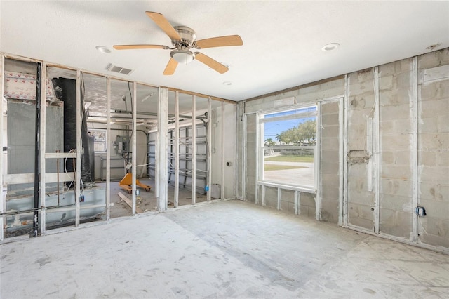 misc room with visible vents and a ceiling fan