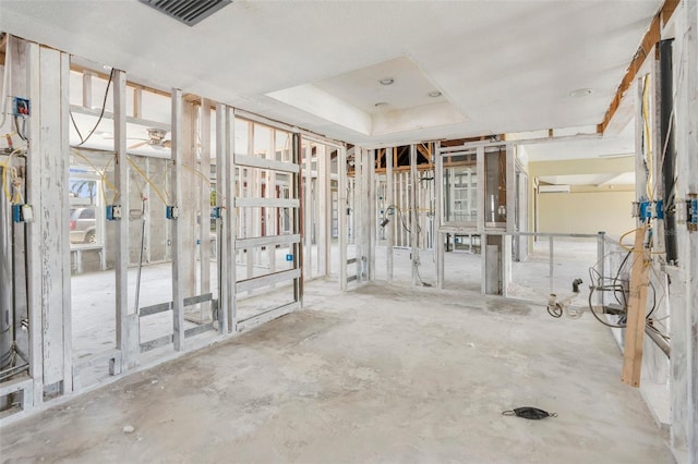 misc room featuring visible vents and a raised ceiling