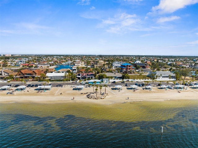 aerial view with a water view, a beach view, and a residential view