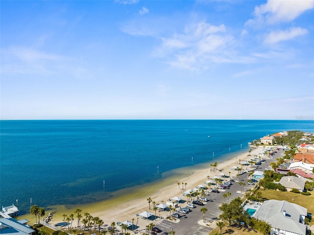 drone / aerial view featuring a water view and a beach view