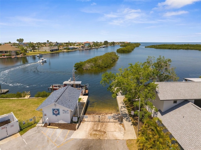 birds eye view of property with a water view