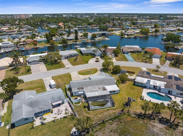 birds eye view of property featuring a water view and a residential view
