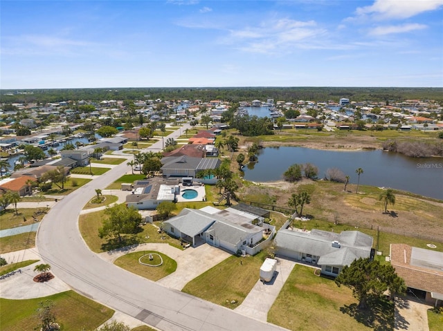 bird's eye view with a water view and a residential view
