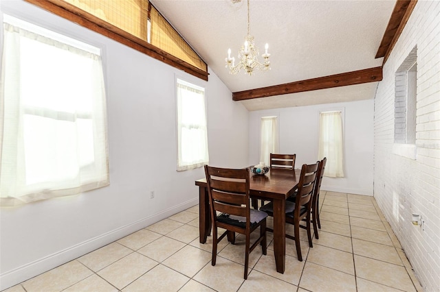 dining space with lofted ceiling with beams, a textured ceiling, brick wall, light tile patterned floors, and an inviting chandelier