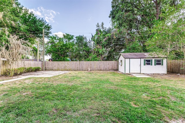 view of yard featuring a fenced backyard, an outdoor structure, and a storage shed