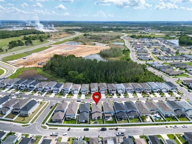 birds eye view of property featuring a residential view and a water view