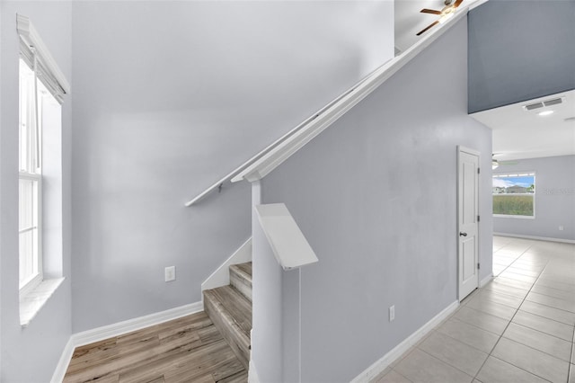 582 Royal Empress Dr, Ruskin, FL 33570 - stairs with a ceiling fan and tile patterned floors
