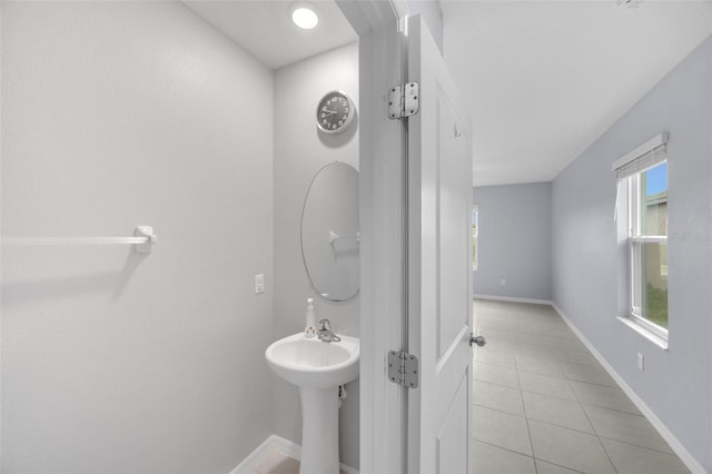582 Royal Empress Dr, Ruskin, FL 33570 - bathroom with tile patterned flooring and baseboards