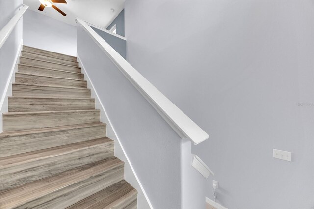 582 Royal Empress Dr, Ruskin, FL 33570 - stairs with a ceiling fan and wood finished floors