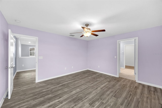 582 Royal Empress Dr, Ruskin, FL 33570 - unfurnished room featuring ceiling fan, dark wood finished floors, and a smoke detector