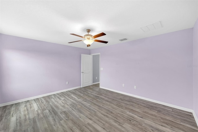582 Royal Empress Dr, Ruskin, FL 33570 - spare room with a ceiling fan and wood finished floors